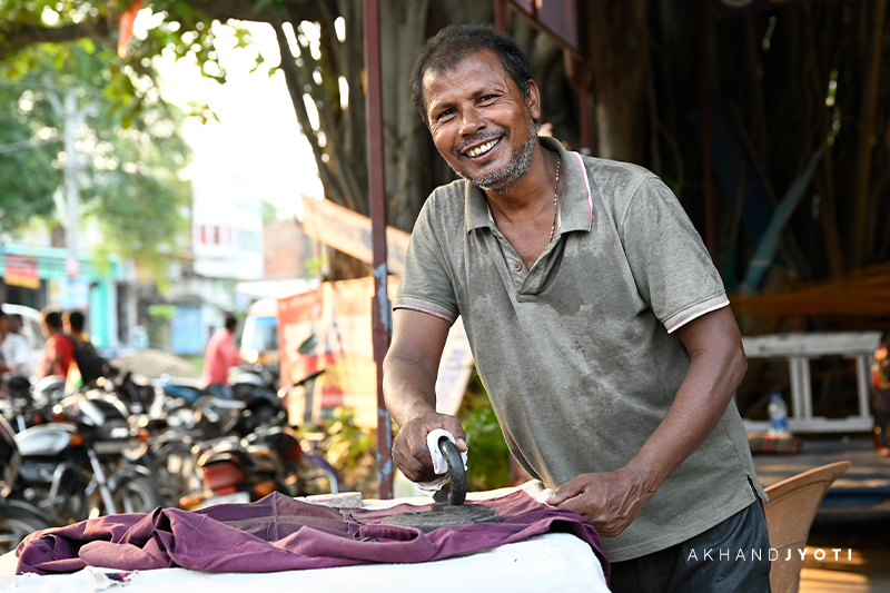 Shivi ji working at his laundry shop